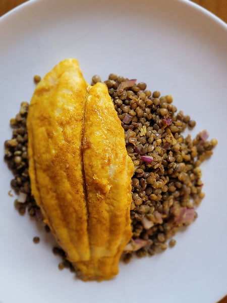 Roast white fish with spiced puy lentils